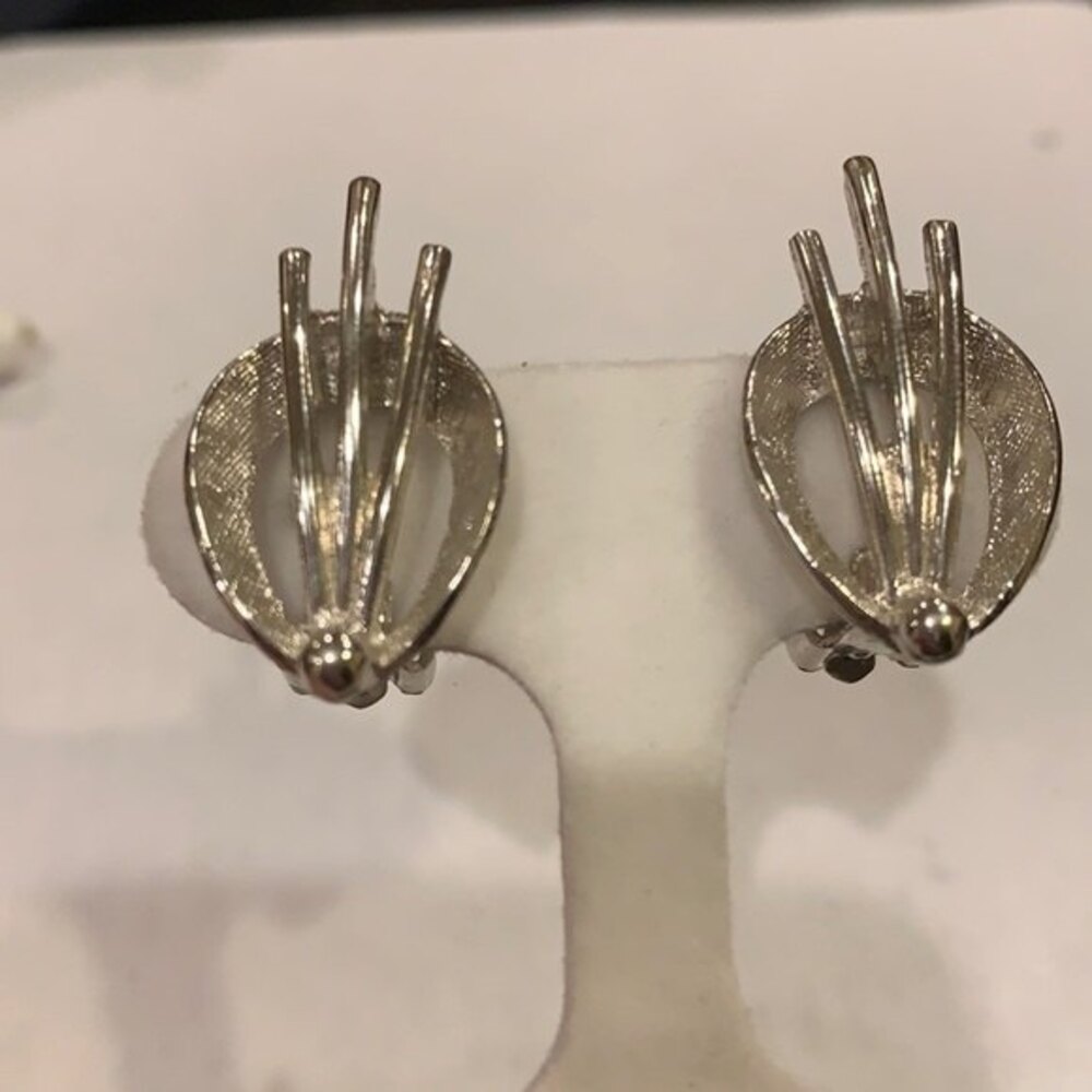 Deco silver tone clip earrings